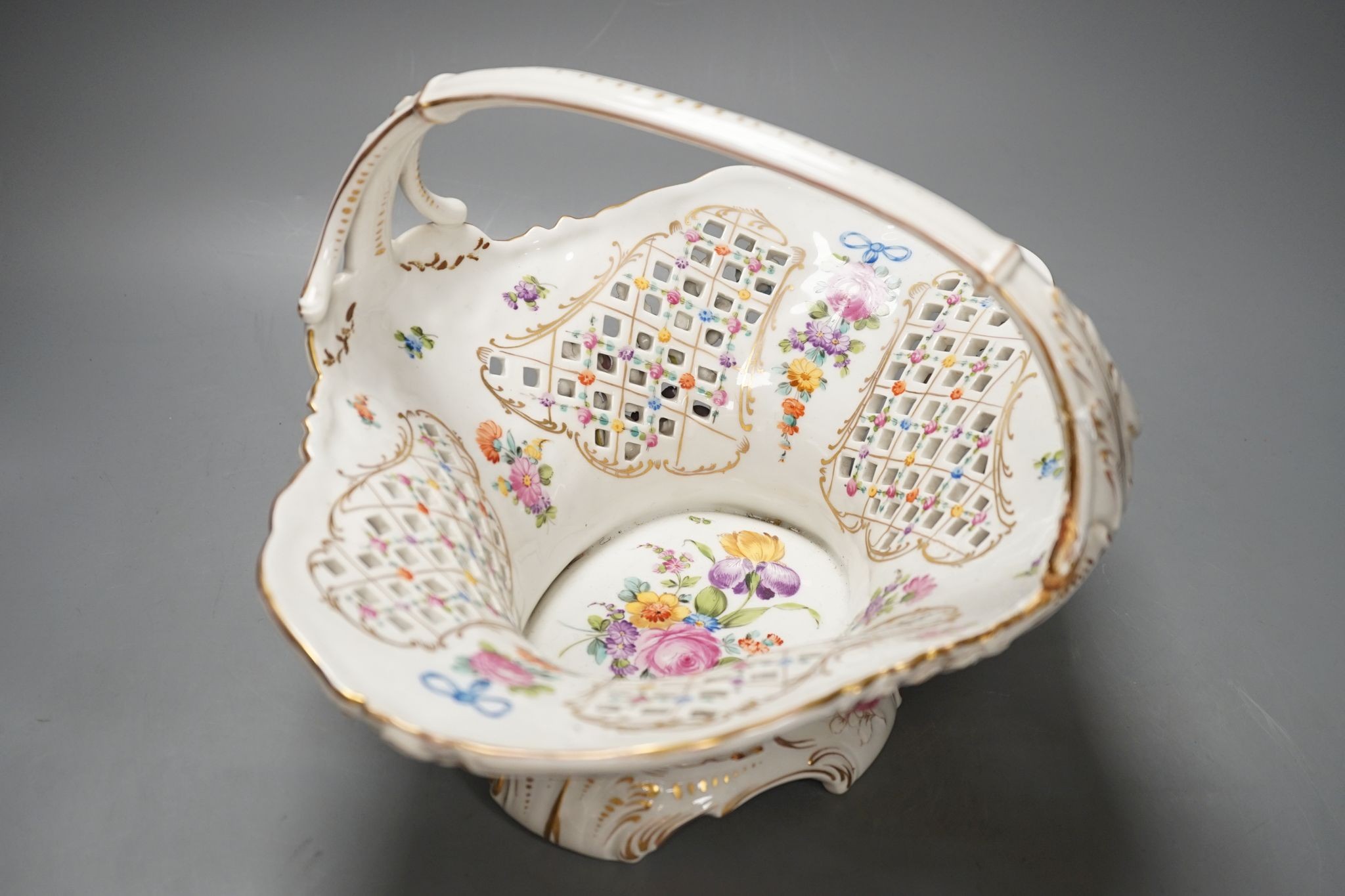 A Dresden porcelain floral encrusted basket 34cm